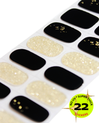 Sheet of black and gold nail wrap with a label indicating '22 stickers' on a white background.