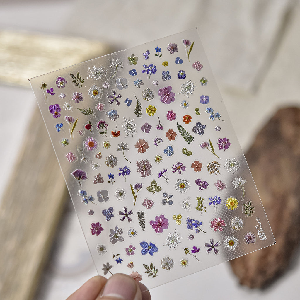 Mini floral nail art stickers sheet with colourful flower decals for nail decoration.