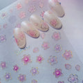 3D pink sakura flower nail art stickers with holographic outline shown with decorated sample nails.