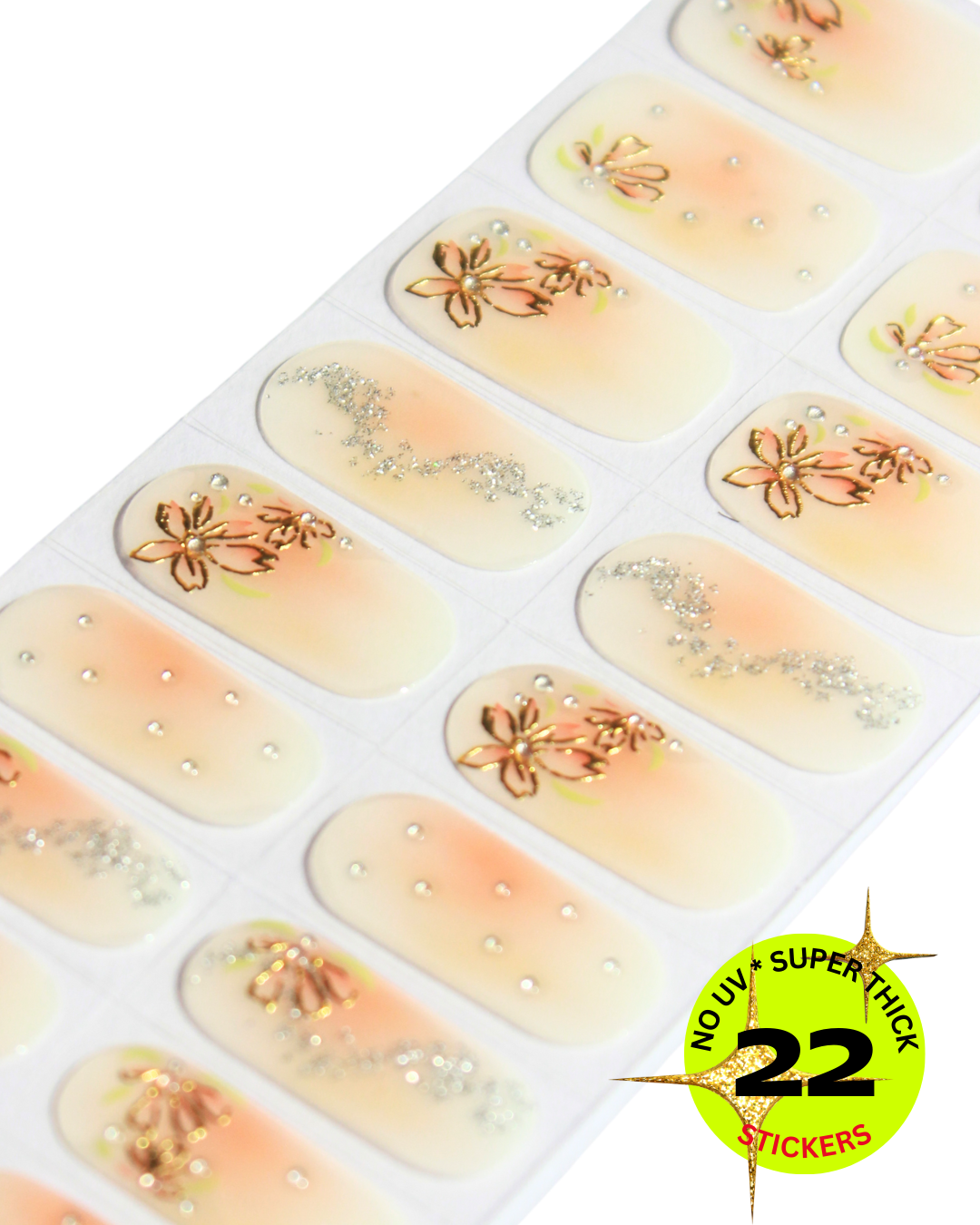Sheet of peach gradient nail stickers decorated with metallic flowers