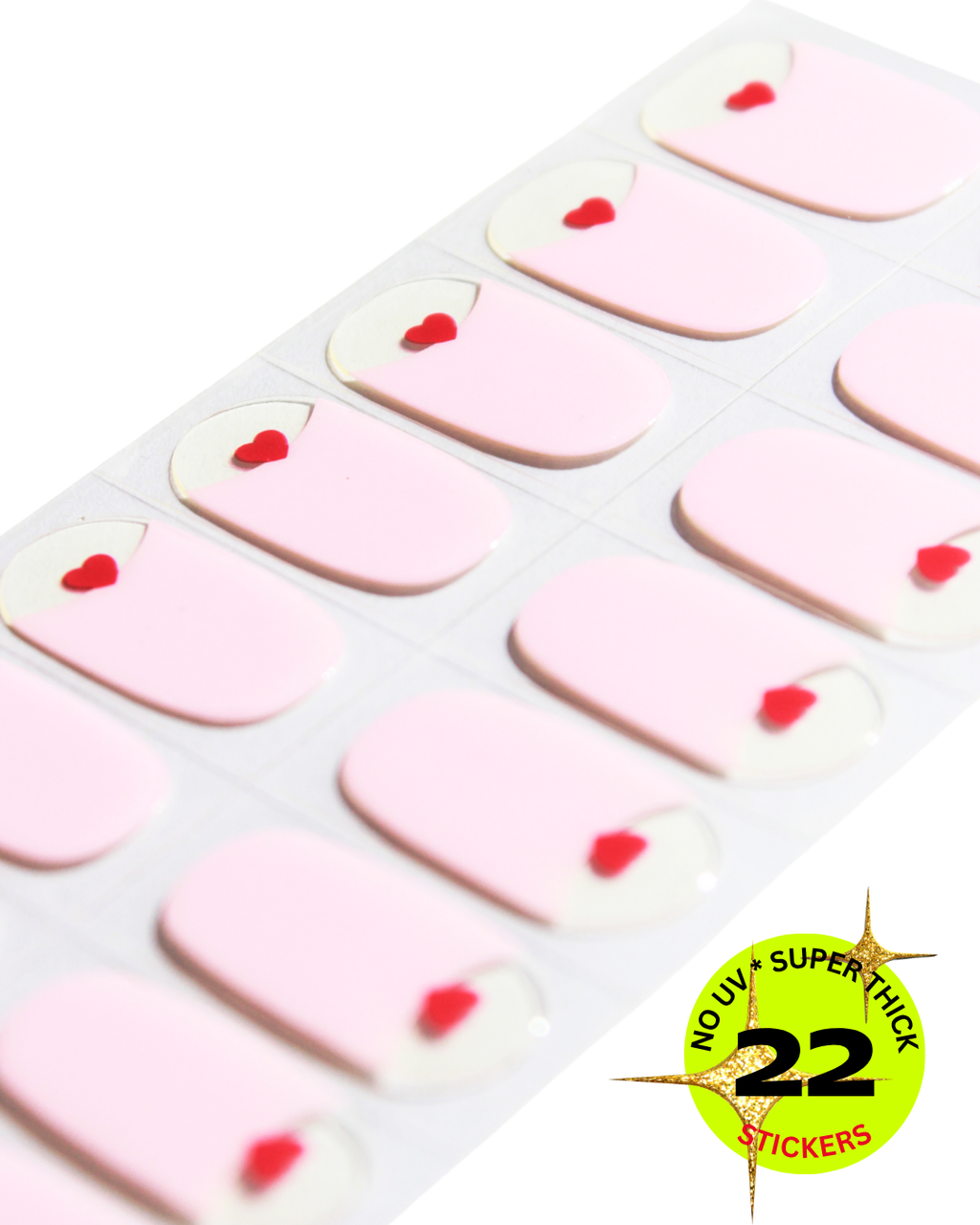 Light pink nail wrap stickers with small red heart tips .