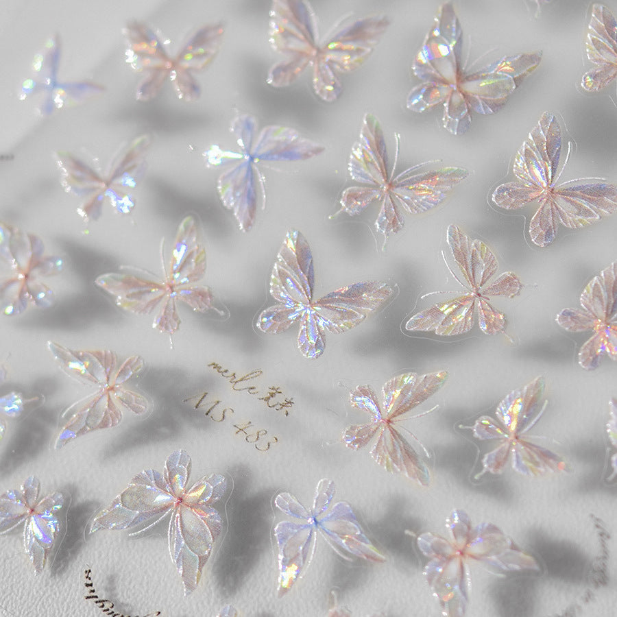 Holographic 3D butterfly nail stickers with crystal-clear wings and pearly finish.