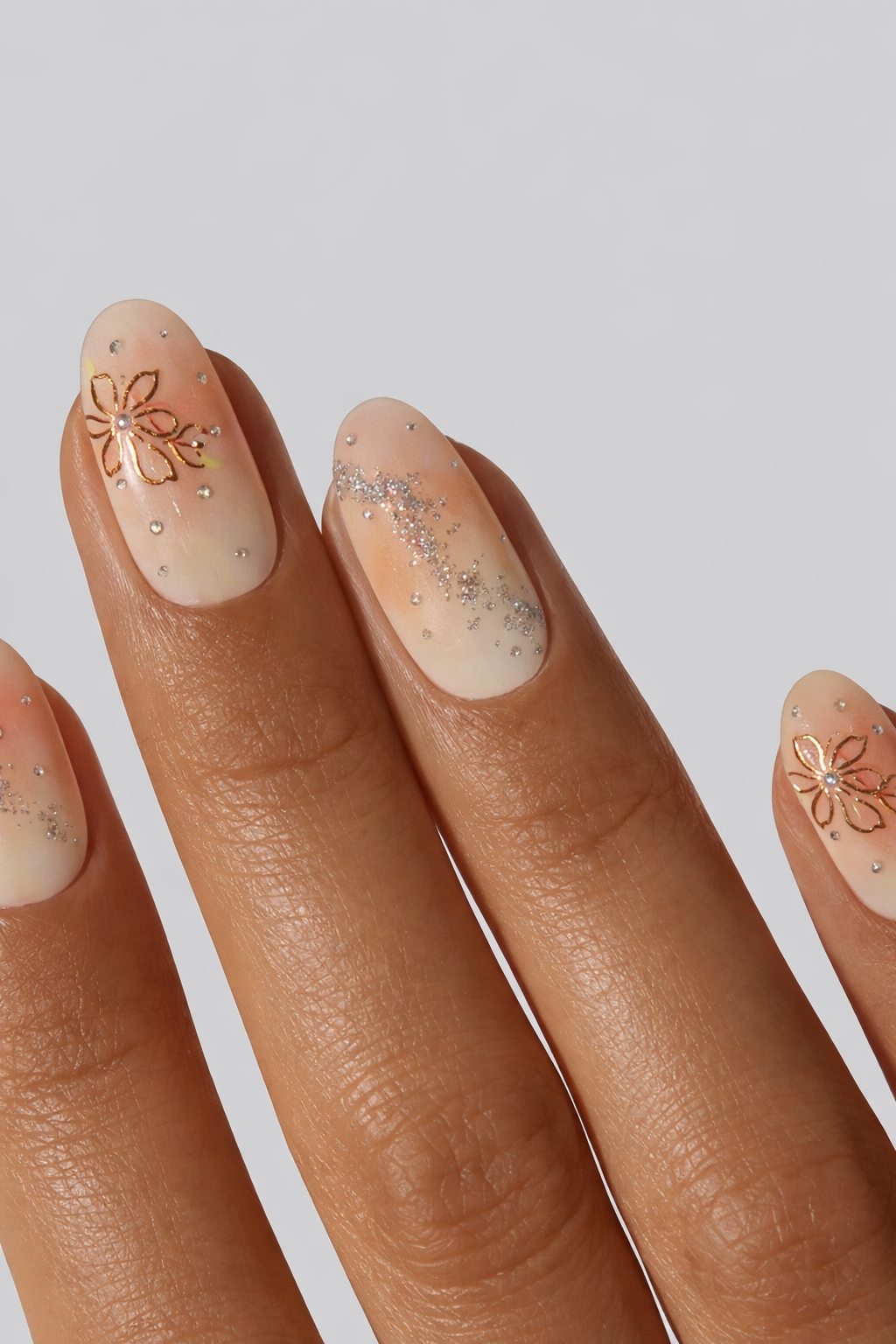 Nails with decorative designs on a neutral background