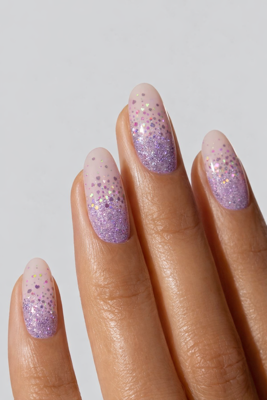 “Lavender glitter ombre manicure with sparkly nail wraps, close-up nail detail”