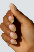 Gold glitter French tip nail wrap manicure .