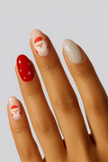 Nail art with Santa Claus design on a neutral background
