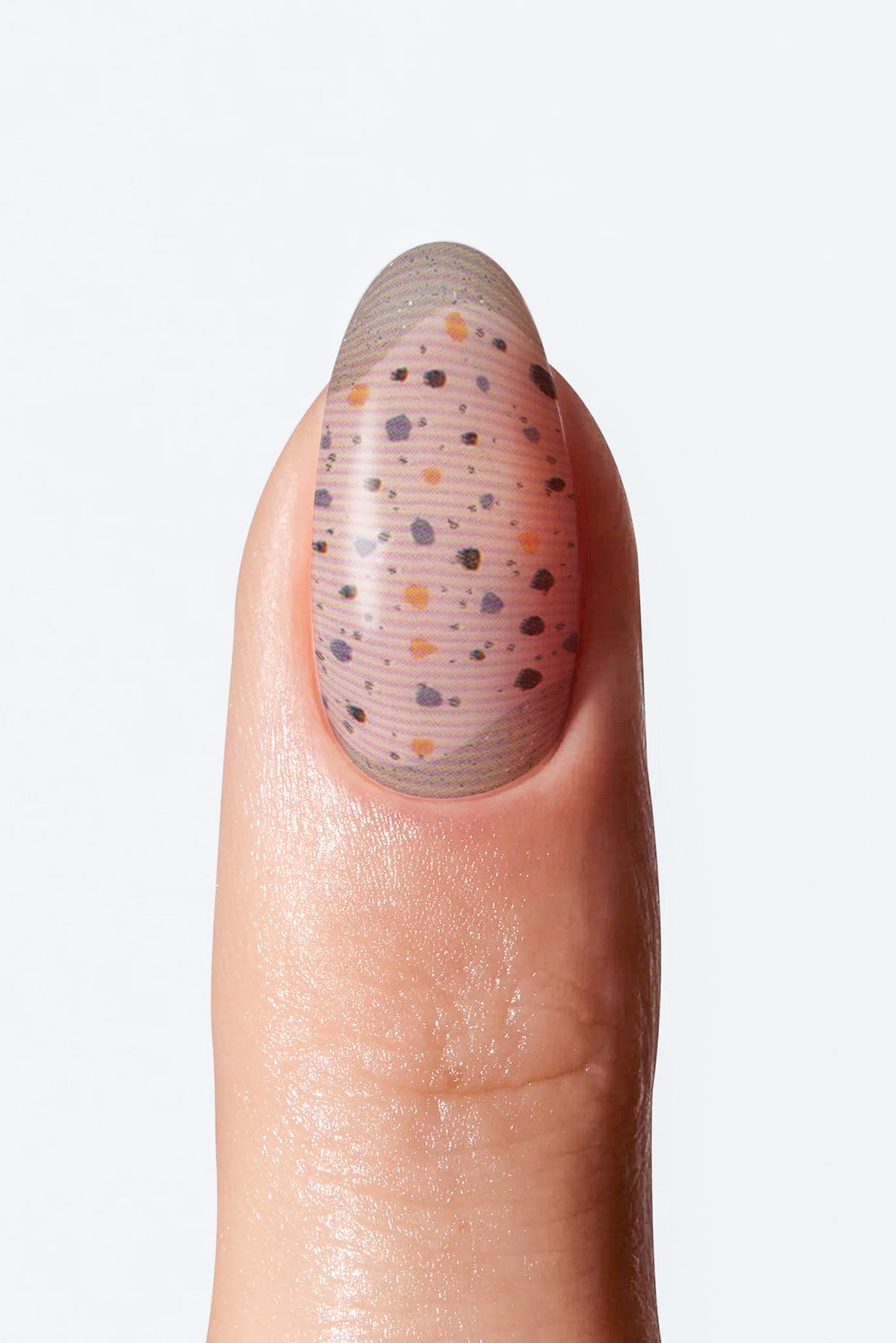 Neutral manicure nail wrap featuring transparent base with multicolor speckles