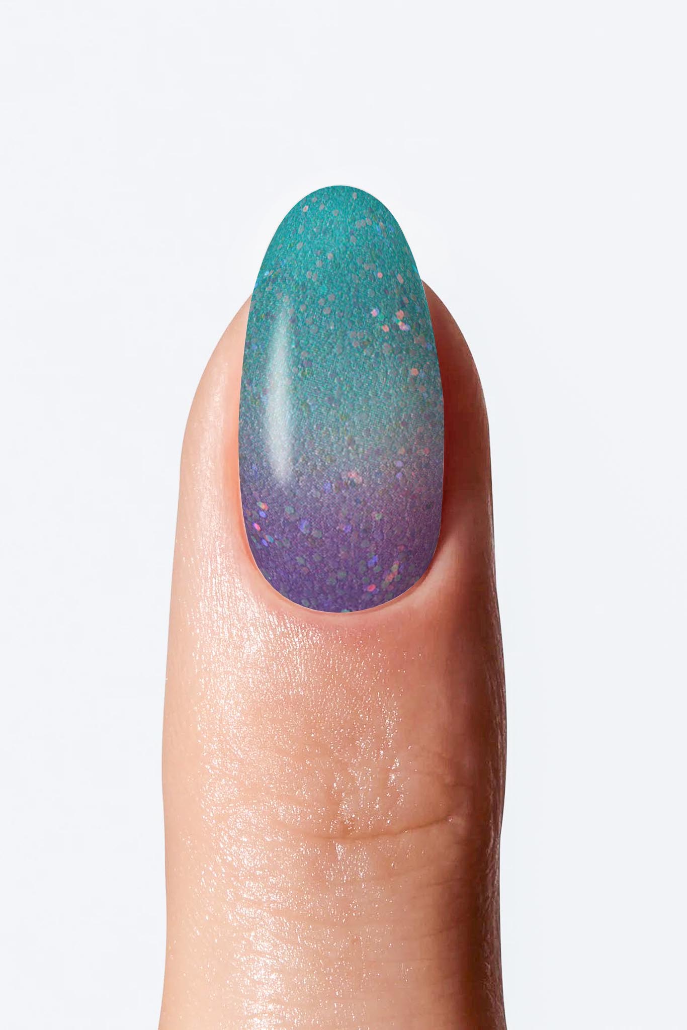 A single finger with a nail wrap showing a gradient color change from teal blue to purple.