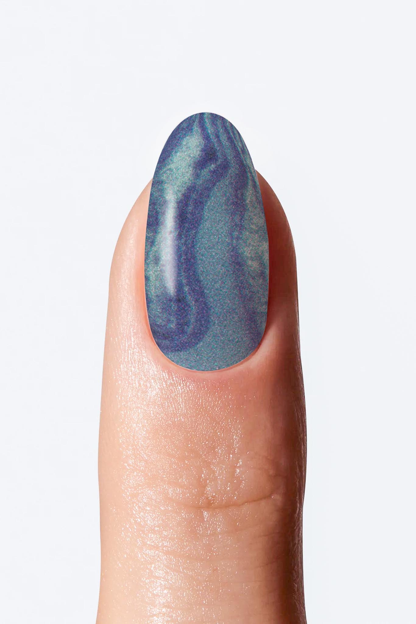 A fingernail with a blue nail wrap applied, showing a marble design.
