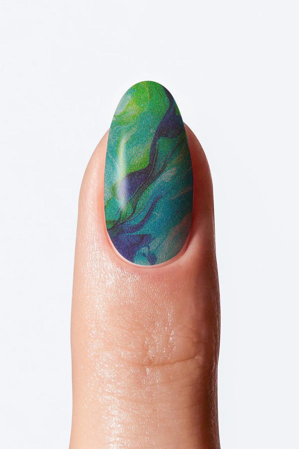 A fingernail with a green and blue nail wrap.