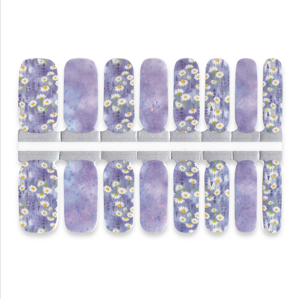 Set of purple nail wraps with white floral designs on a white background