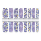 Set of purple nail wraps with white floral designs on a white background
