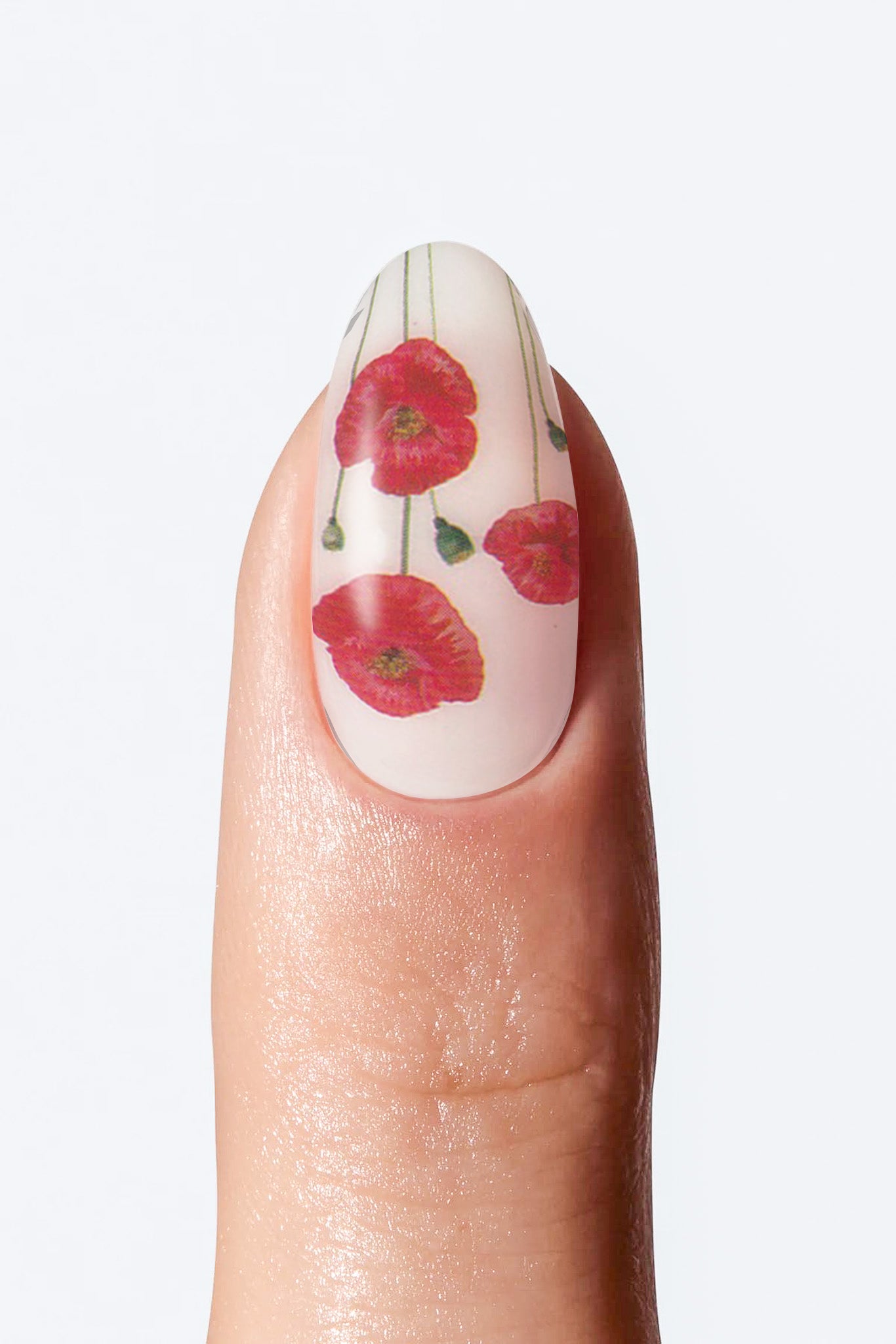 Close-up of nail with white base and small red flower artwork
