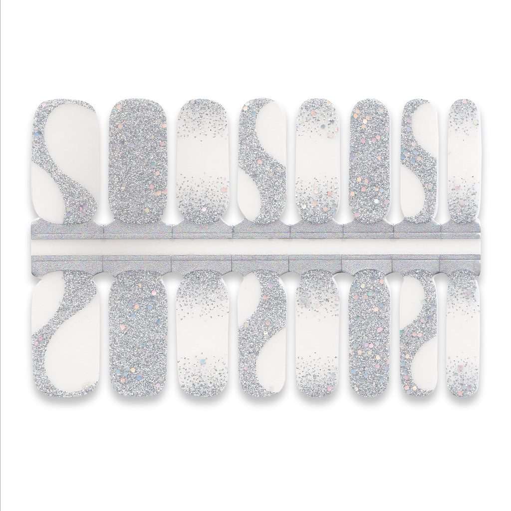 Sheet of clear and silver glitter nail wraps with shimmer gradient pattern