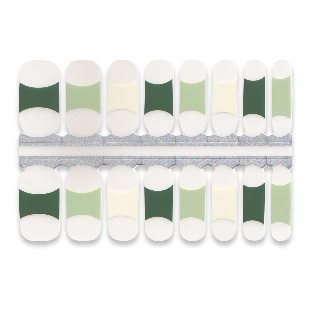 Minimalist nail wraps featuring nude base with light and dark green French tips.