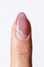 Soft mauve pink  nail wrap manicure with subtle wavy line accent.