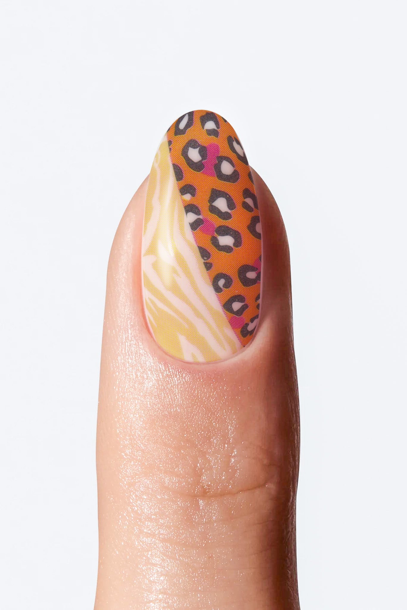Nail with leopard print and marbled design on a light gray background