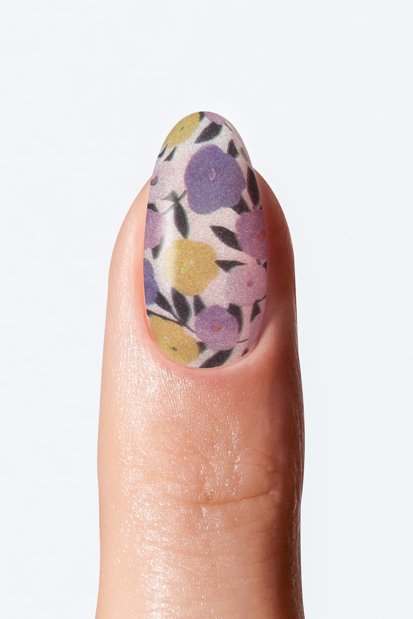 Nail with floral design on a light gray background
