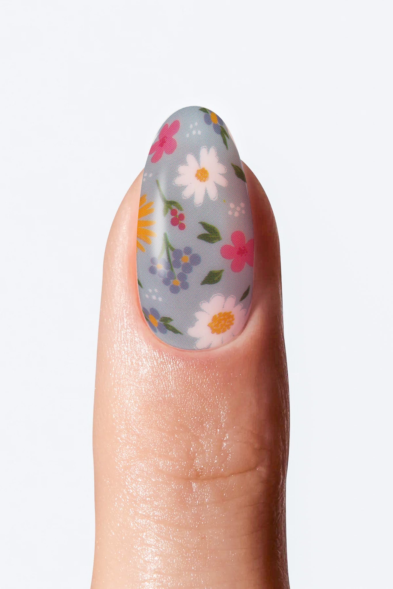 Nail with floral design on a light gray background