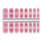 Set of pink nail wraps with designs on a white background