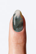 Marble manicure nail wrap with deep green and grey gradient pattern
