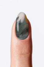 Marble manicure nail wrap with deep green and grey gradient pattern