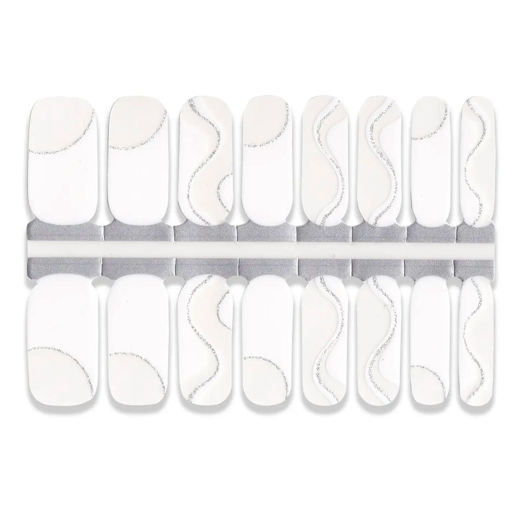 Set of white nail wraps with abstract designs on a white background