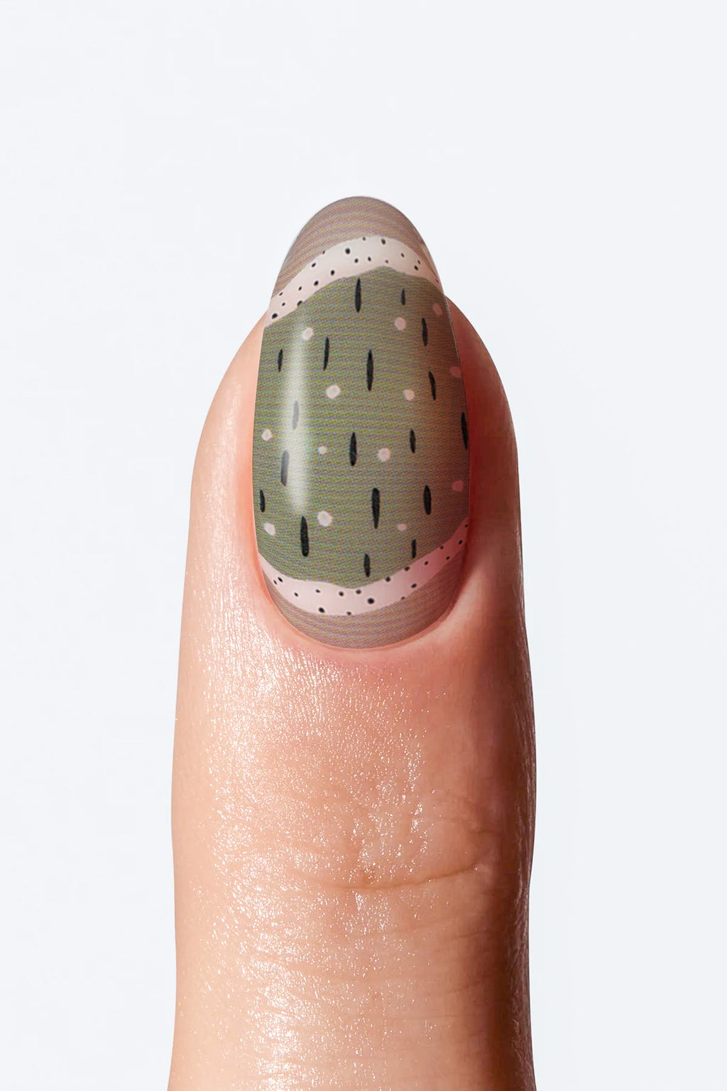 Close-up of nail with muted green base and small black dot details