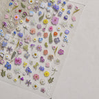 Collection of small embroidered flowers on light background