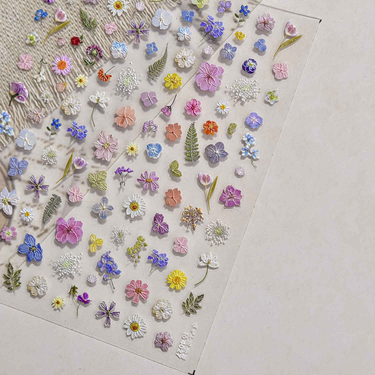 Collection of small embroidered flowers on light background