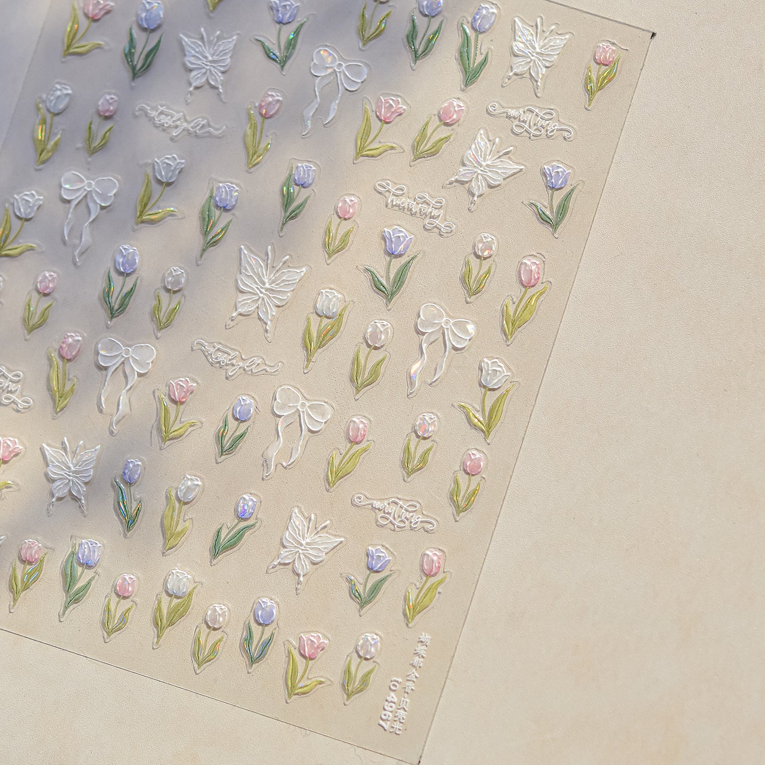 Decorative stickers with flowers, butterflies, and ribbons on a beige background