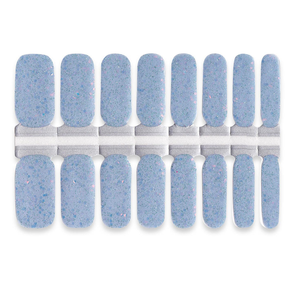 Dusty sky-blue nail wraps set featuring delicate speckled glitter for a soft textured sparkle finish.