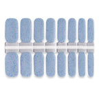 Dusty sky-blue nail wraps set featuring delicate speckled glitter for a soft textured sparkle finish.