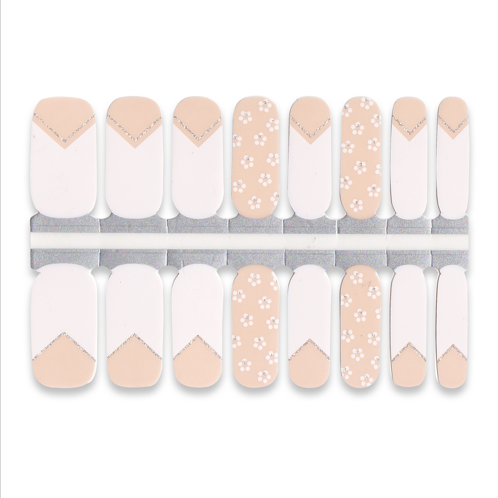Set of light nude and white nail wraps featuring French tips and small floral patterns