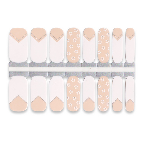 Set of light nude and white nail wraps featuring French tips and small floral patterns