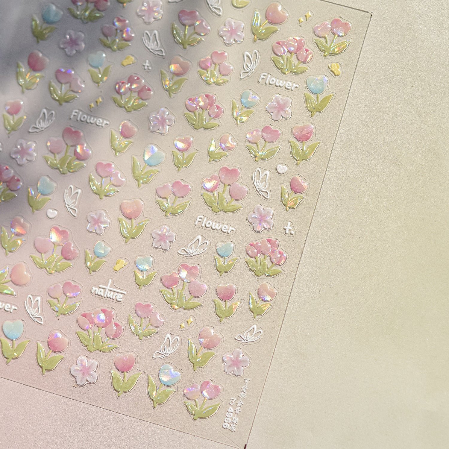 “Pastel 3D flower nail art sticker sheet with iridescent detailing.”