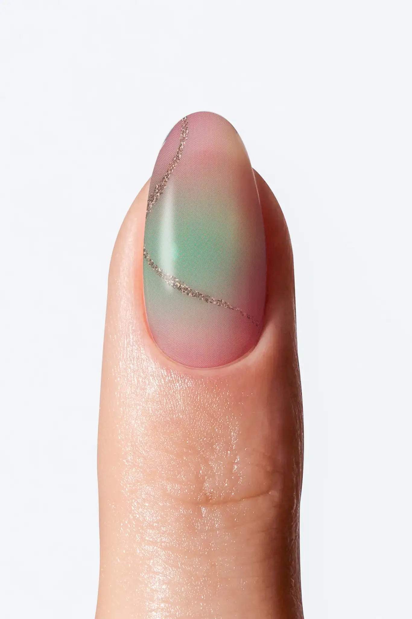 A close-up image of a fingernail wrap with a marble-like design, with a fine gold line detailing.