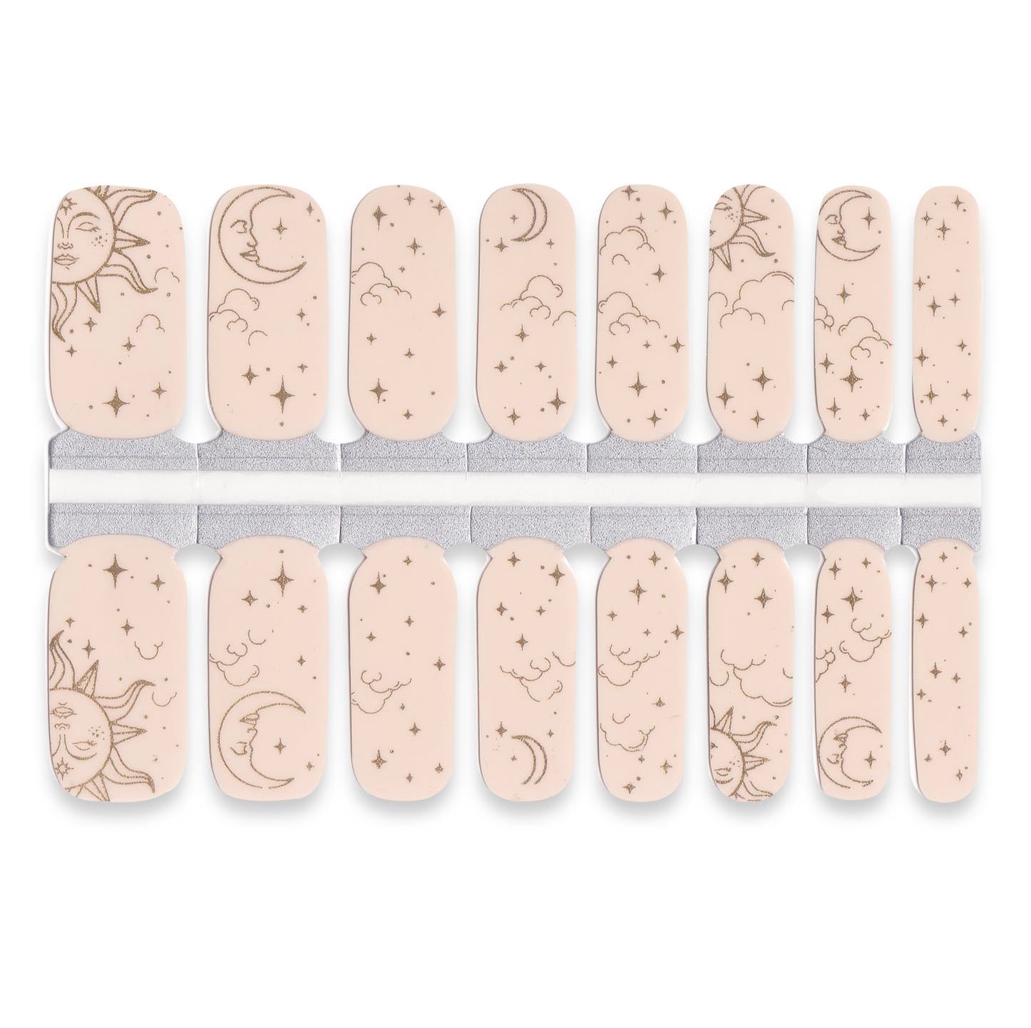 Celestial nude nail wraps featuring sun, moon and star illustrations on soft beige base.