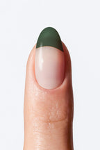 Nude nail wrap with dark green French tip design