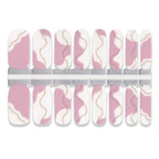 Set of nail wraps with pink and white abstract design on a white background