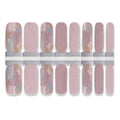 Nail wrap stickers with subtle shimmer and abstract marble accent designs in multiple sizes.