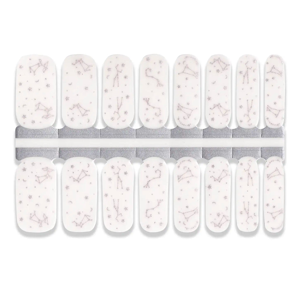 White nail wrap stickers with delicate constellation and star patterns in multiple sizes.