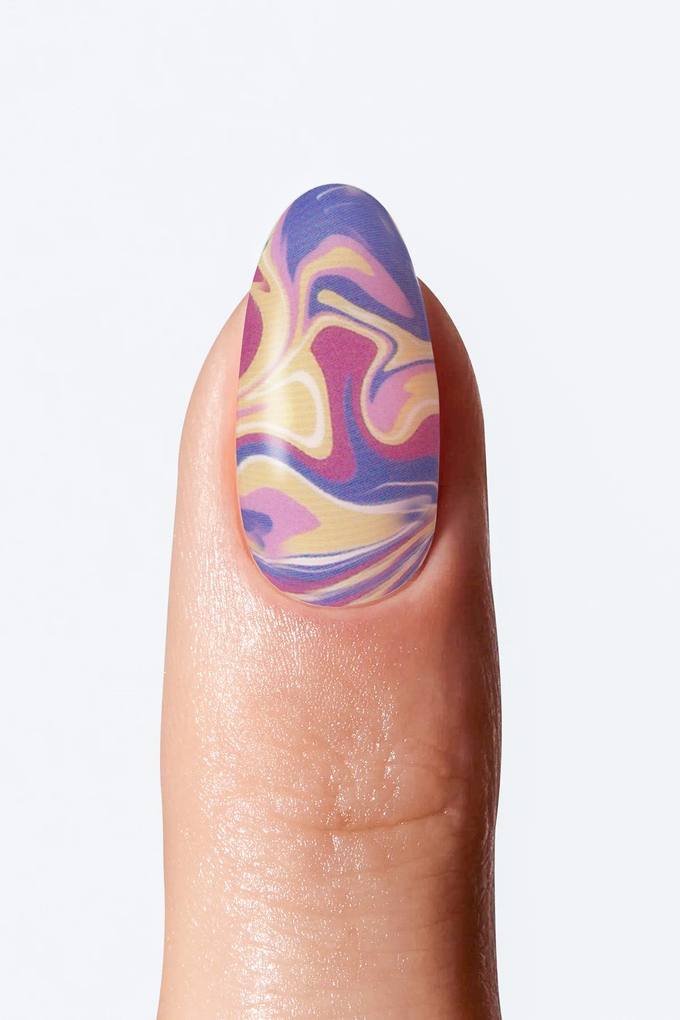 Nail with colorful marbled design on a white  background