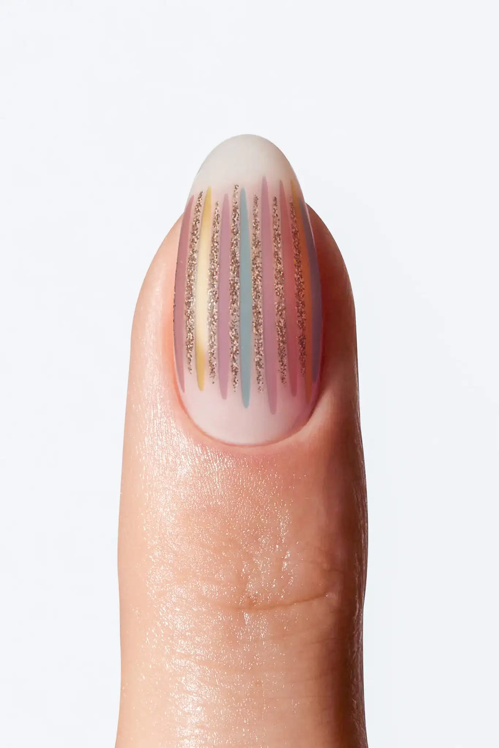 Nude striped nail wrap with pastel vertical lines and subtle gold shimmer accents.