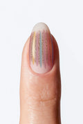 Nude striped nail wrap with pastel vertical lines and subtle gold shimmer accents.