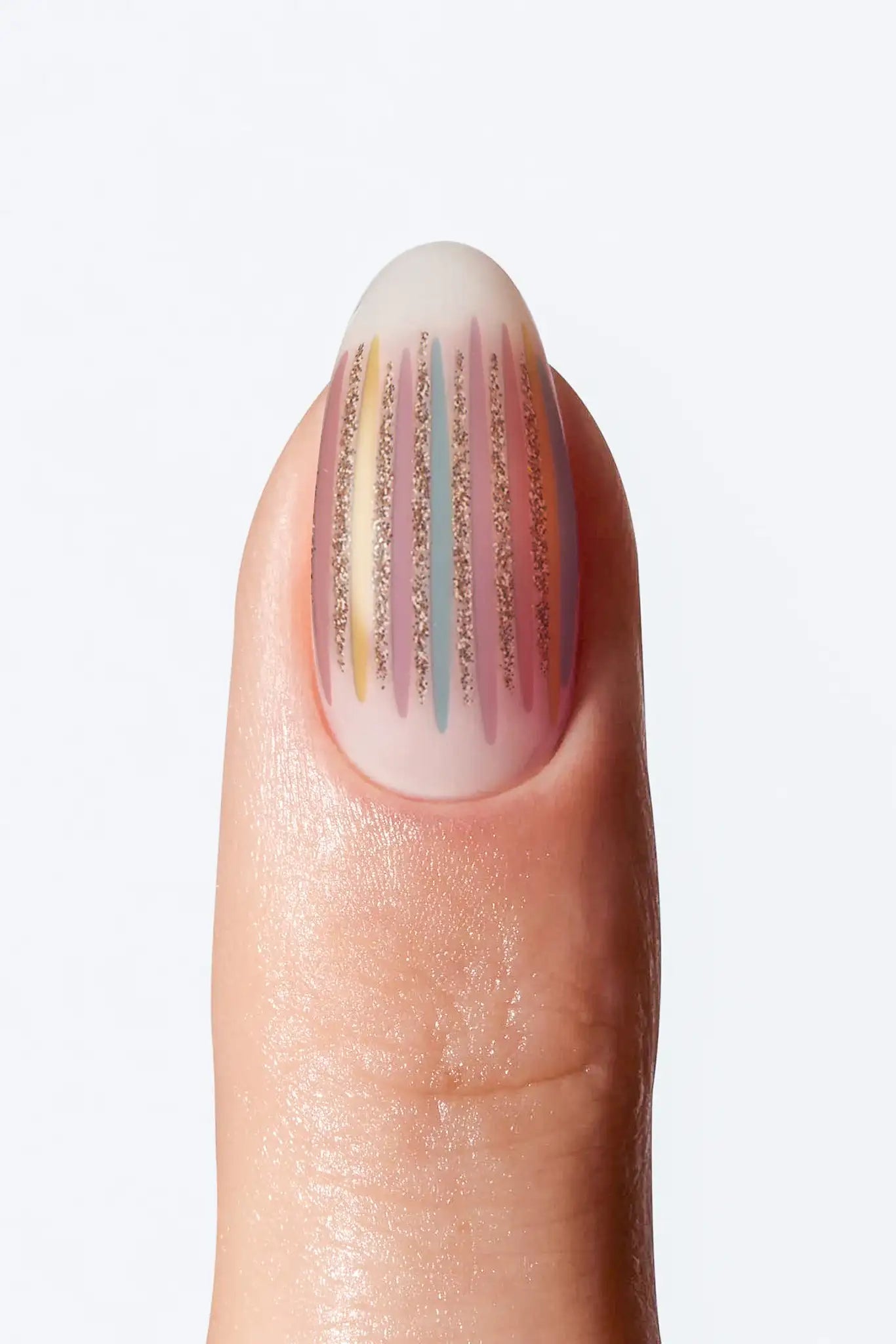 Nude striped nail wrap with pastel vertical lines and subtle gold shimmer accents.