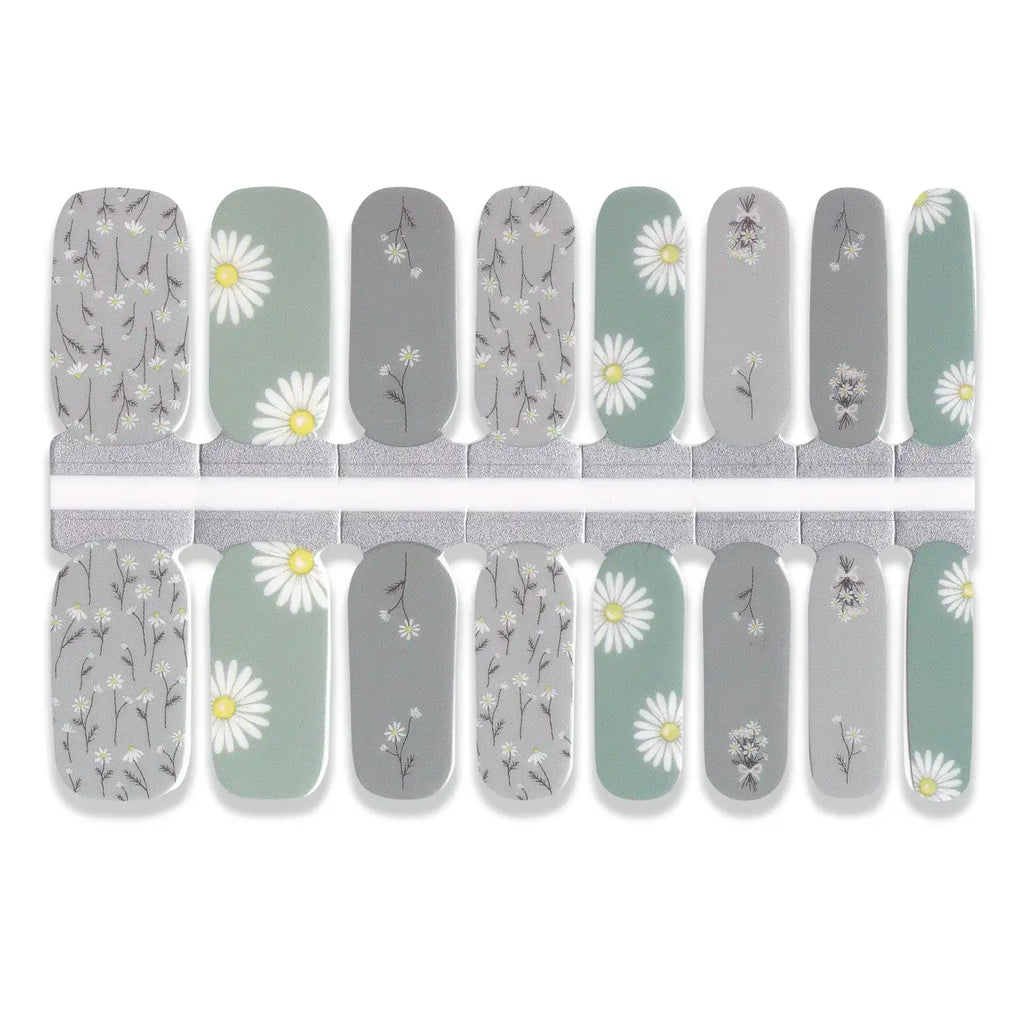 Set of nail wraps with floral design on a white background